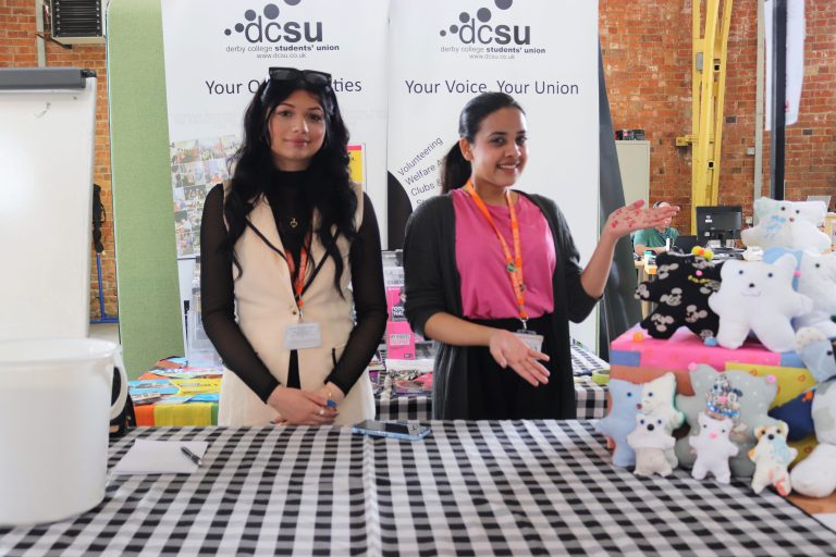 Two business students stood at their stall selling cuddly bears.
