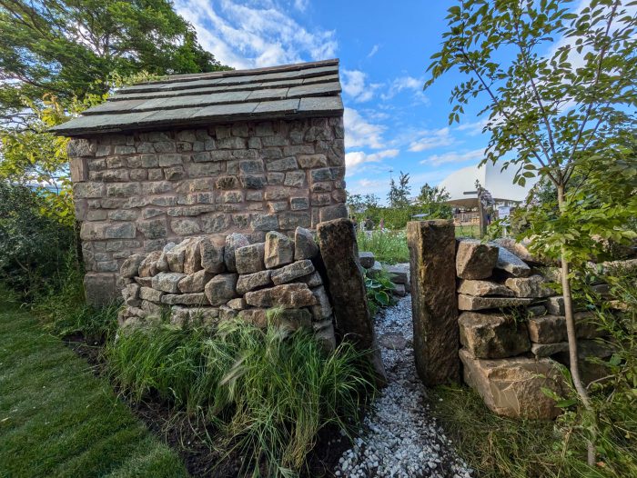 Dry stone wall outhouse and path.