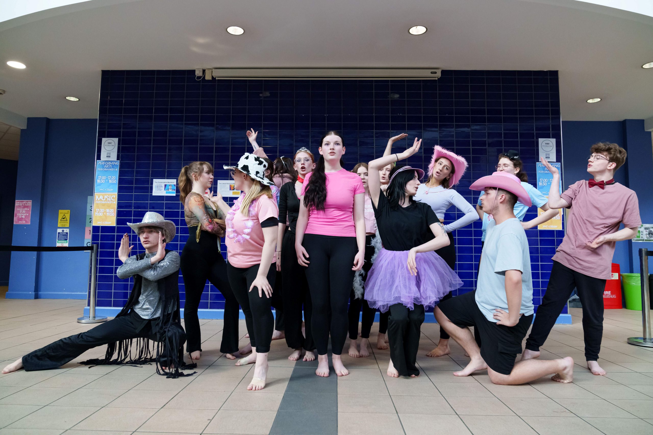 A group of young students performing a dance.