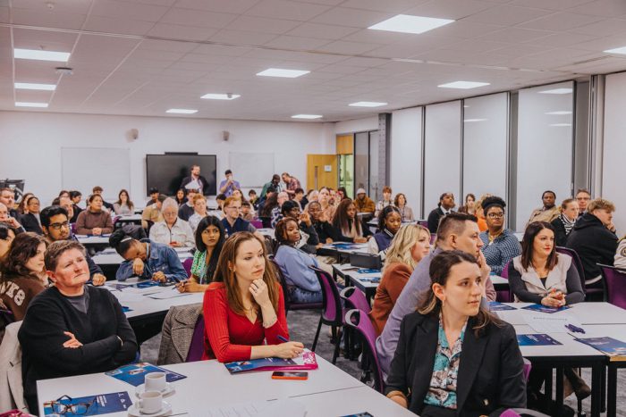 A captivated audience listening to a presentation.